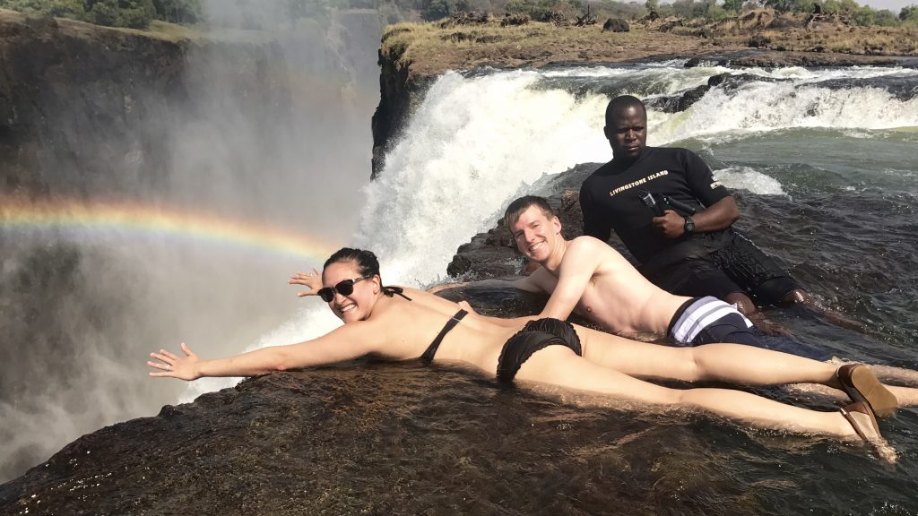 Enjoying one of the most thrilling adventuresof our lives by swimming on the edge of Victoria Falls' Devils Pool. 
