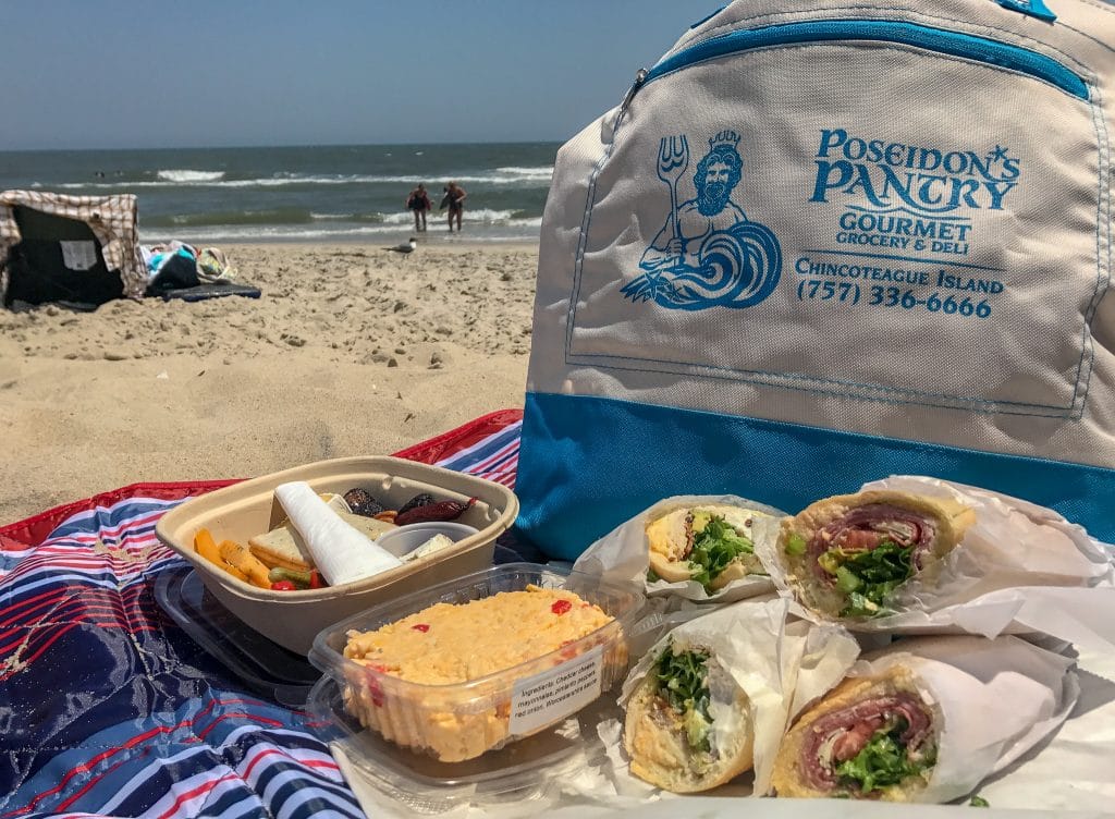 Enjoying a picnic from Poseidon's Pantry is one of the best things to do in Chincoteague!