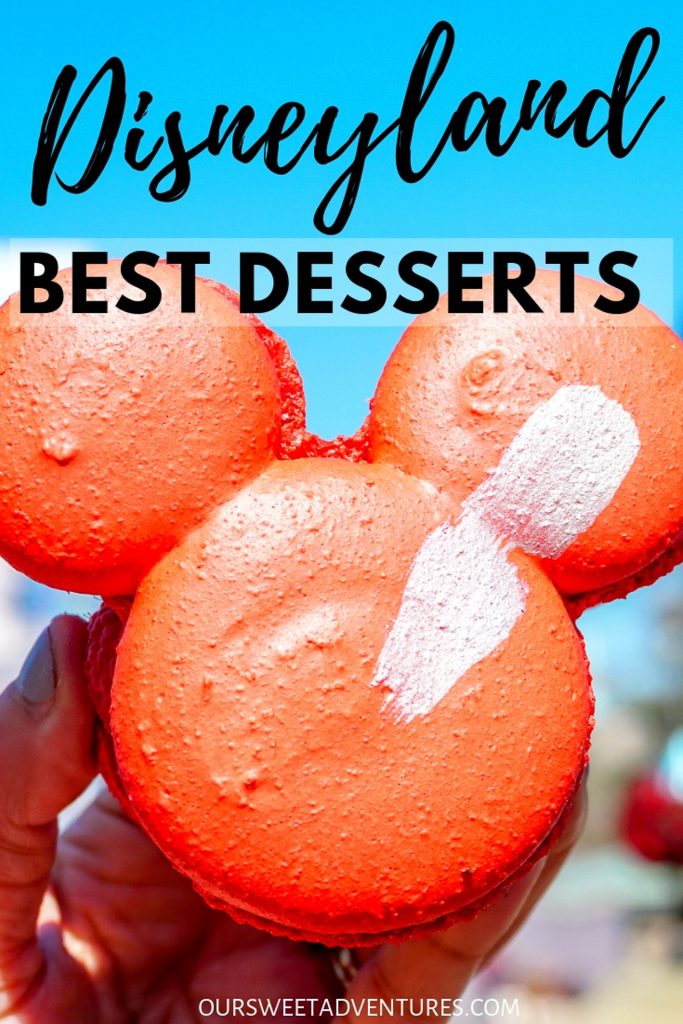 A huge red macaron cookie in the shape of Mickey Mouse's head with text overlay "Disneyland Best Desserts"
