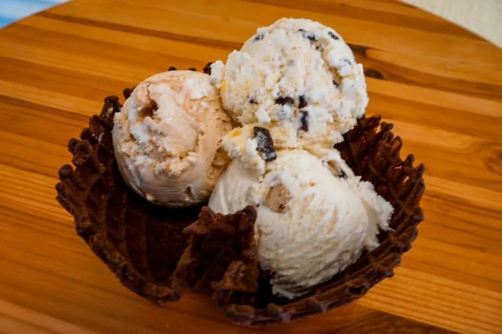 Three scoops of ice cream inside a chocolate waffle cone from Beth Marie's Old Fashioned Ice Cream.