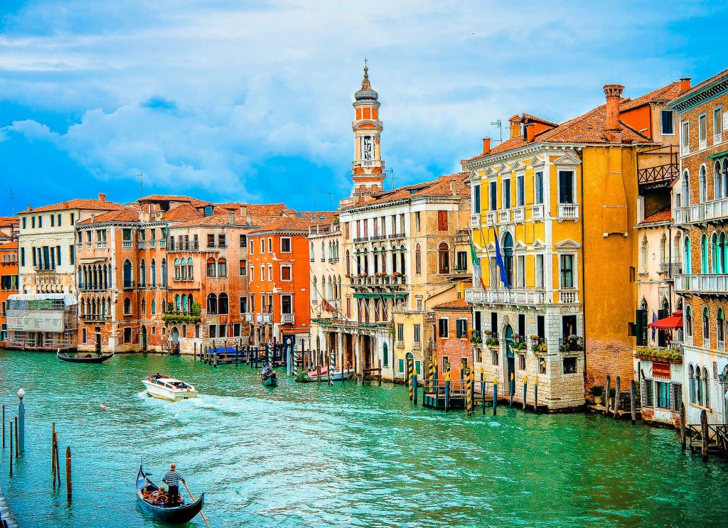 Canal in Venice with colorful buildings along the water.