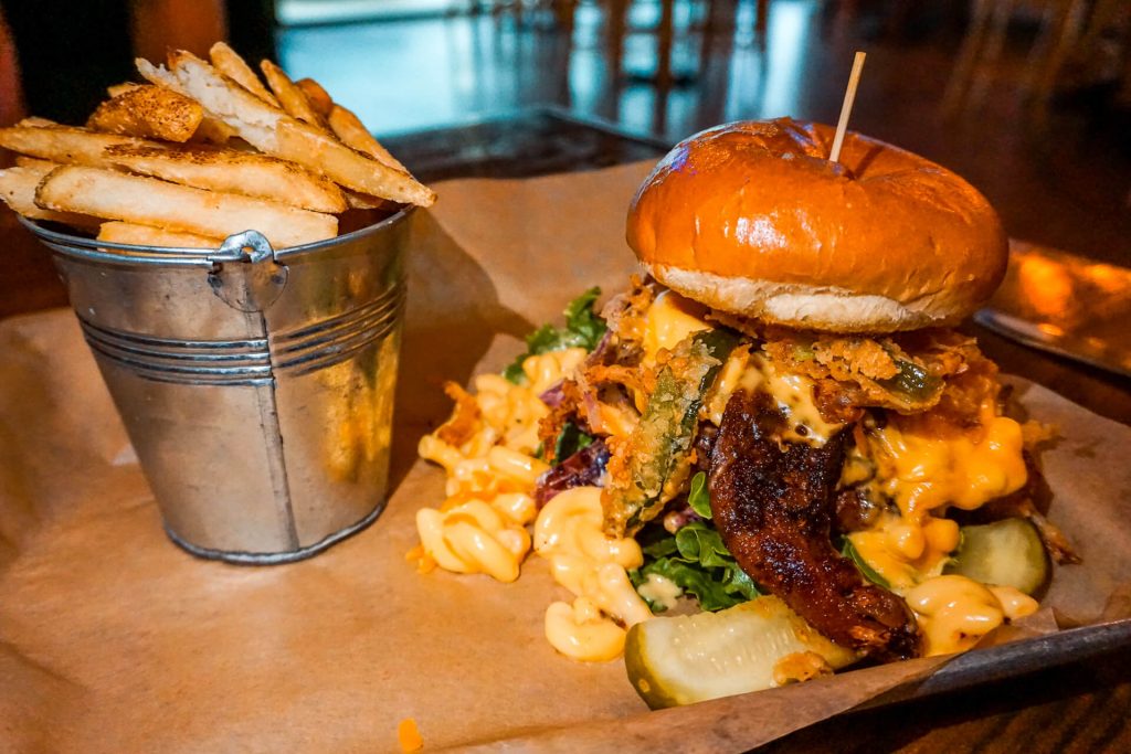 The famous and award-winning Garbage Burger with French fries from E.J. Wells Gastropub in McKinney, Texas.