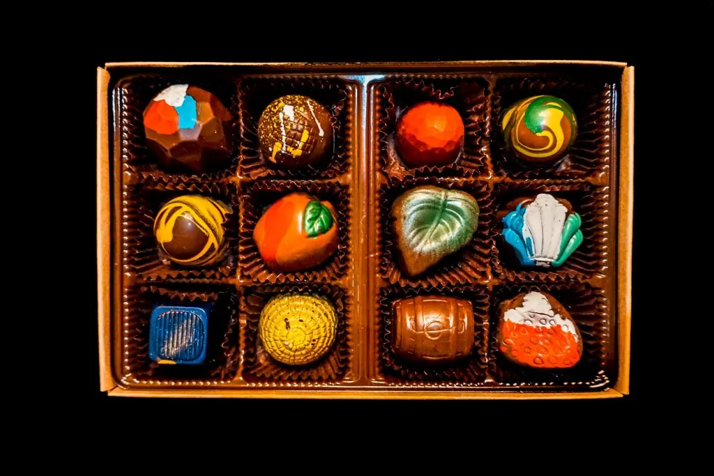 A box full of colorful chocolate truffles from Goodies Texas.