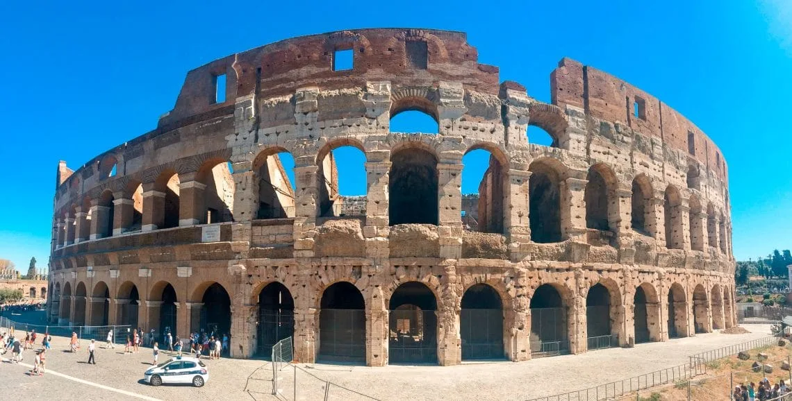 A panorama photo of theColosseum during a bright summer day.