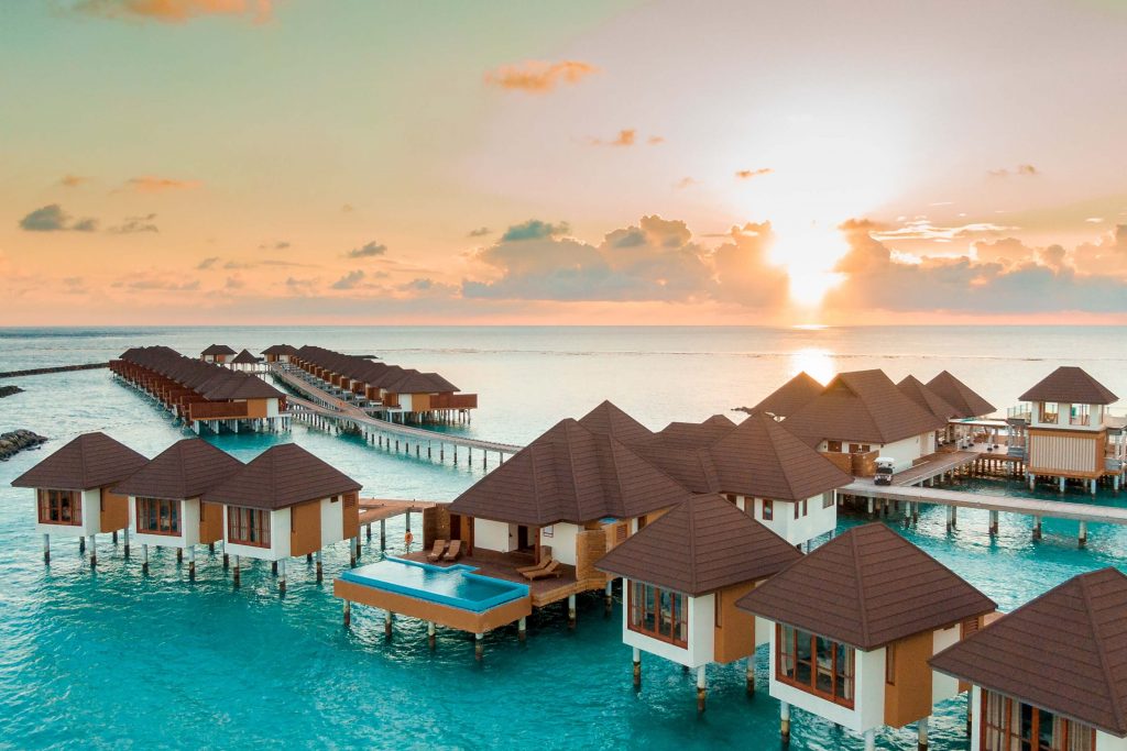 Overwater bungalows in the Maldives, one of the most beautiful babymoon destinations.