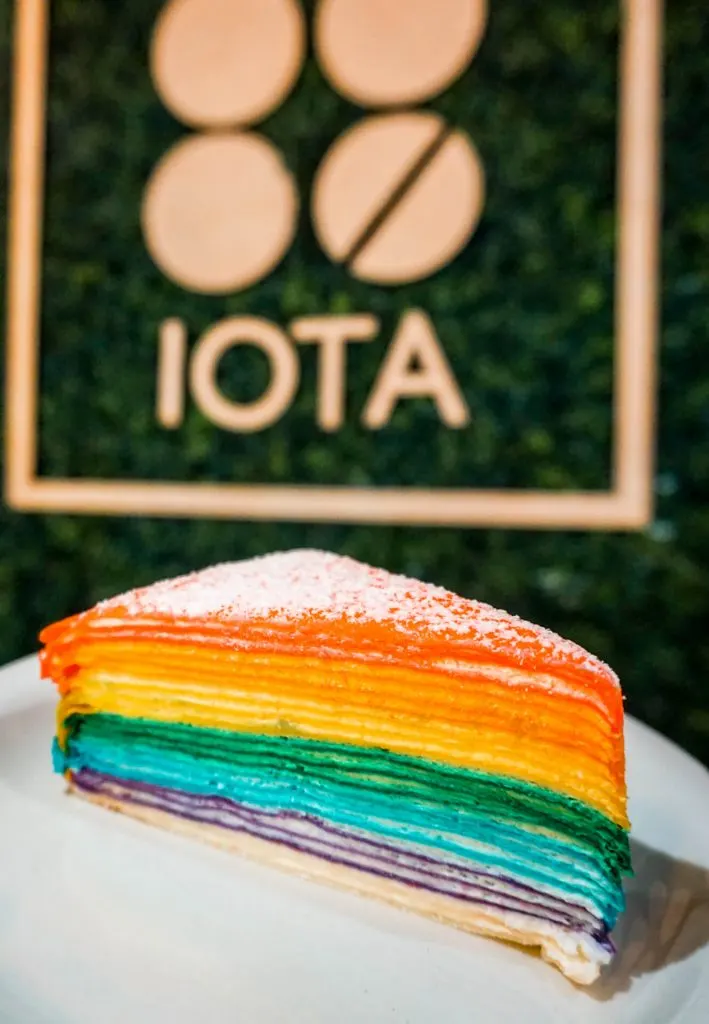 A rainbow crepe cake from Iota Brew Cafe - one of the most instagrammable desserts in Dallas.