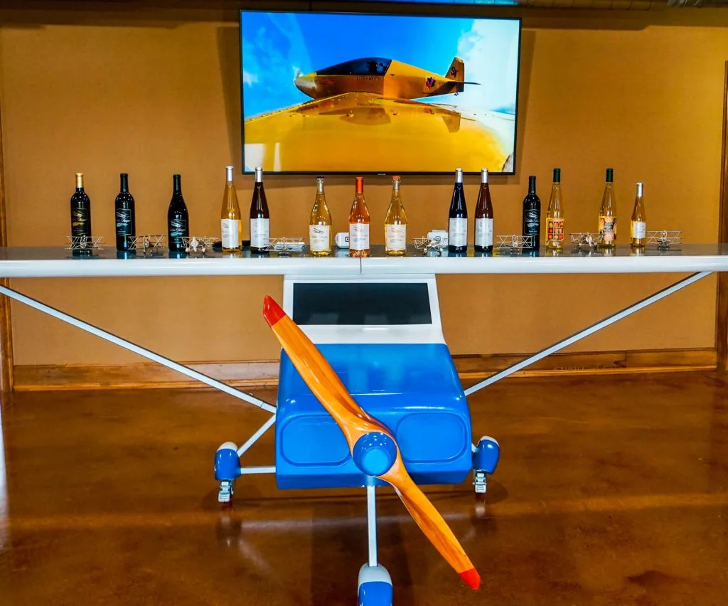 A model plane with bottles of wine on top of it from Hidden Hangar Winery & Vineyard in Denison, Texas.