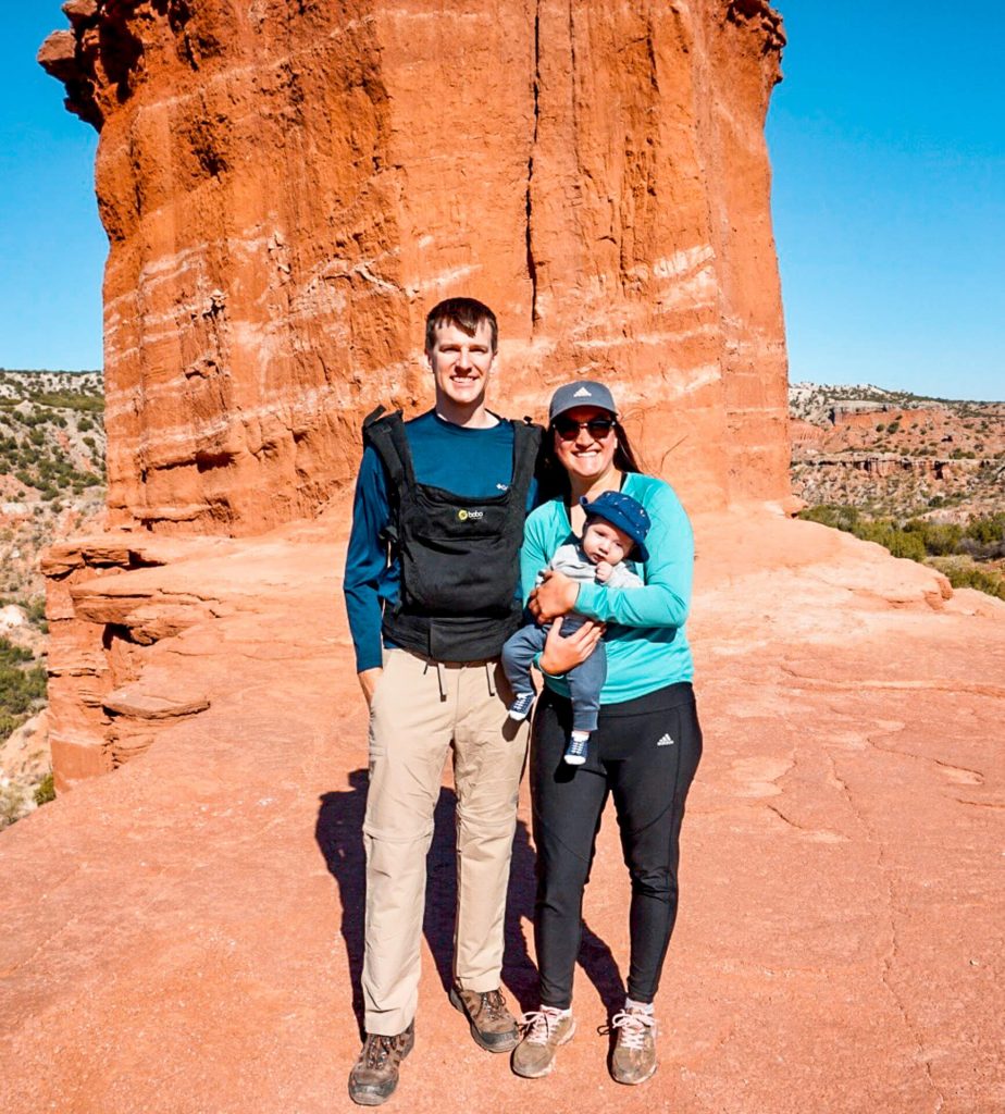 A couple holding their baby at Palo Duro Canyon. A great pit stop when road tripping with a baby.