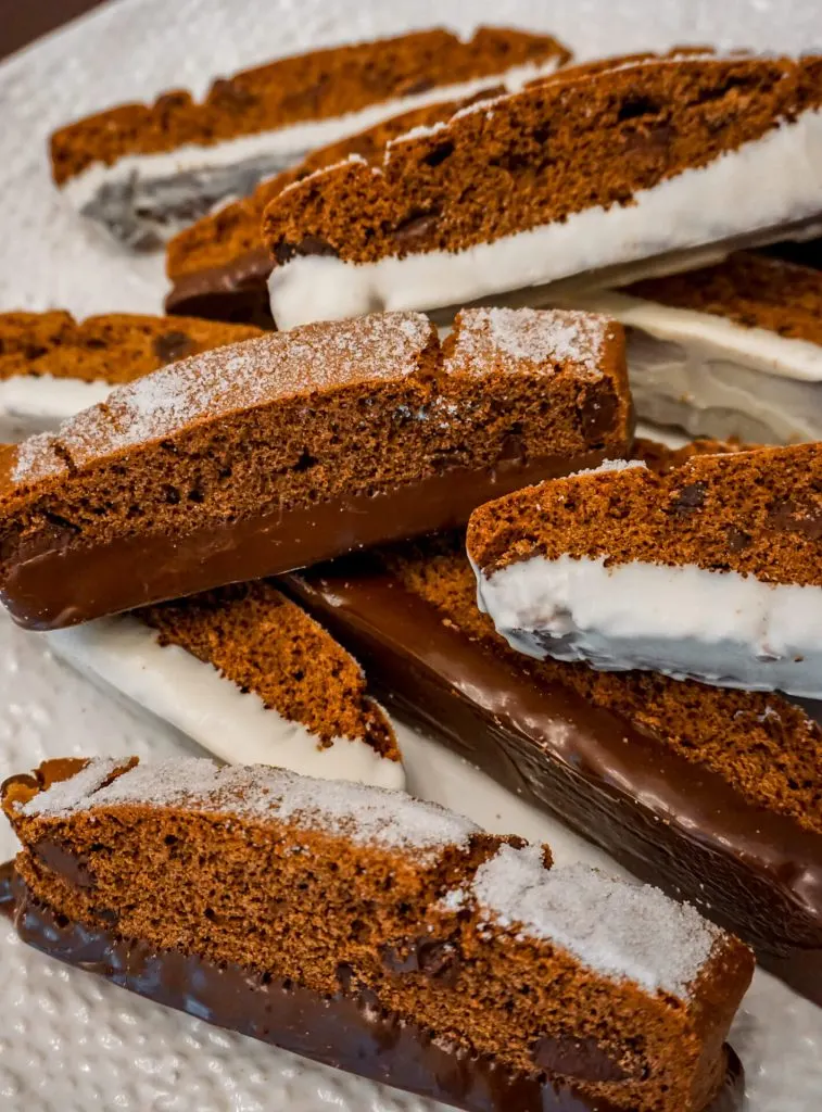 Triple Chocolate Biscotti dipped in dark and white chocolate with sugar sprinkled on top.