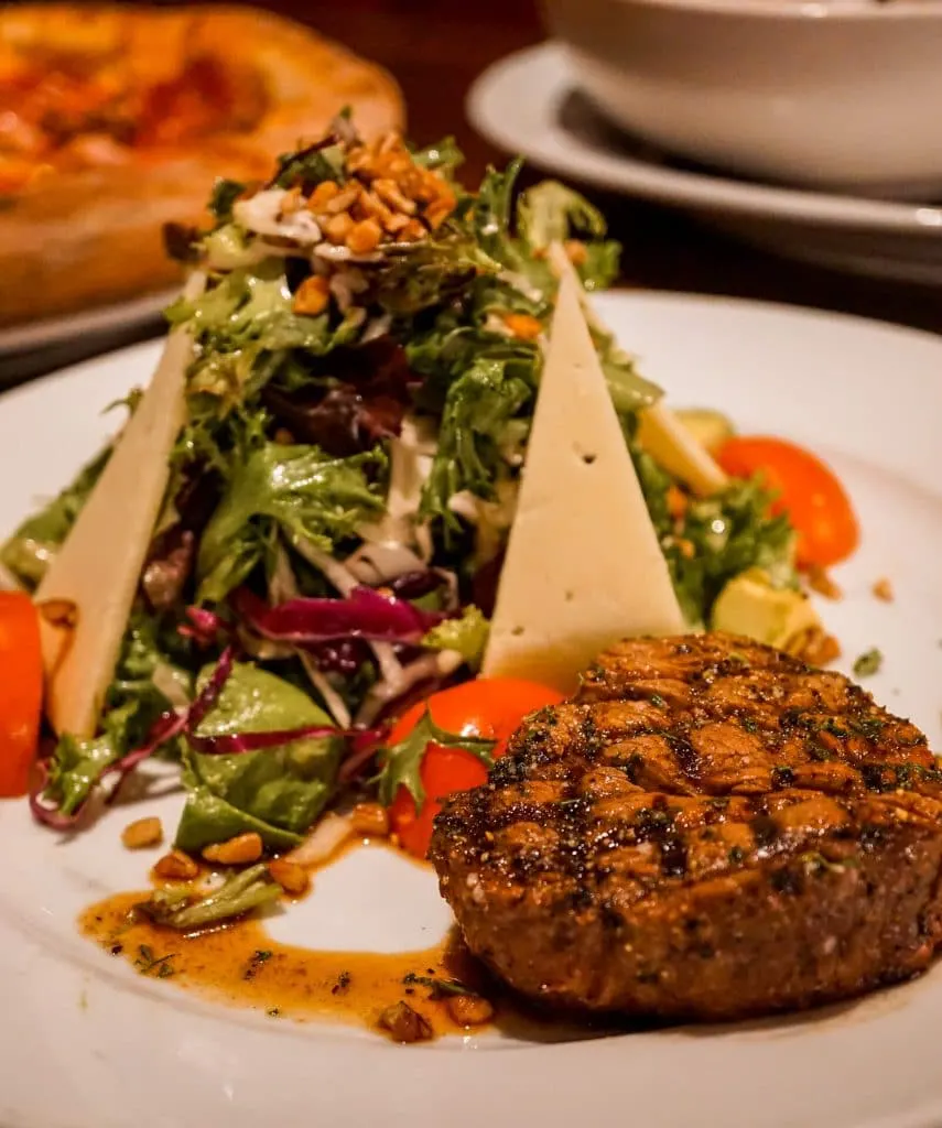 A steak and towering salad from Cork and Pig.