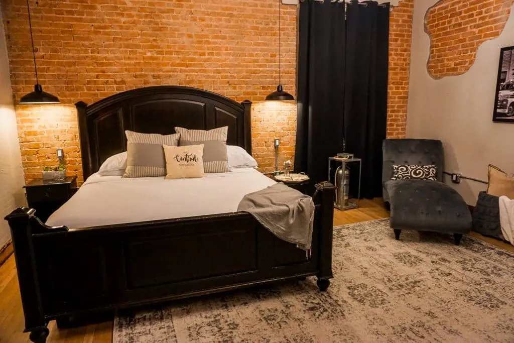 A quaint bedroom in a restored firestation at the Old Central Firehouse Bed and Brew in San Angelo.