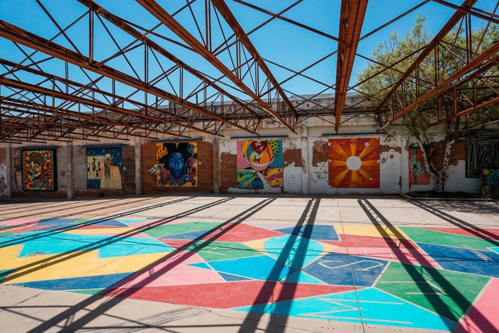 Vibrant colored concrete with pop art paintings. An open air pop art museum from Art in Uncommon Places in San Angelo.