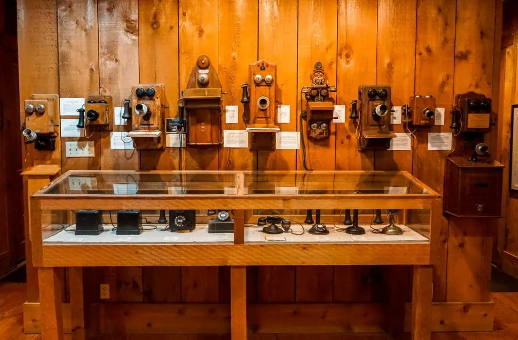 A row of telephones from the 19th century at the E.H. Danner Museum of Telephony