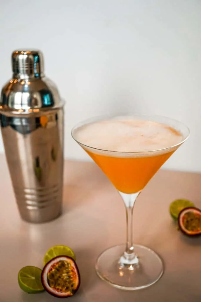 Orange cocktail in a martini glass.