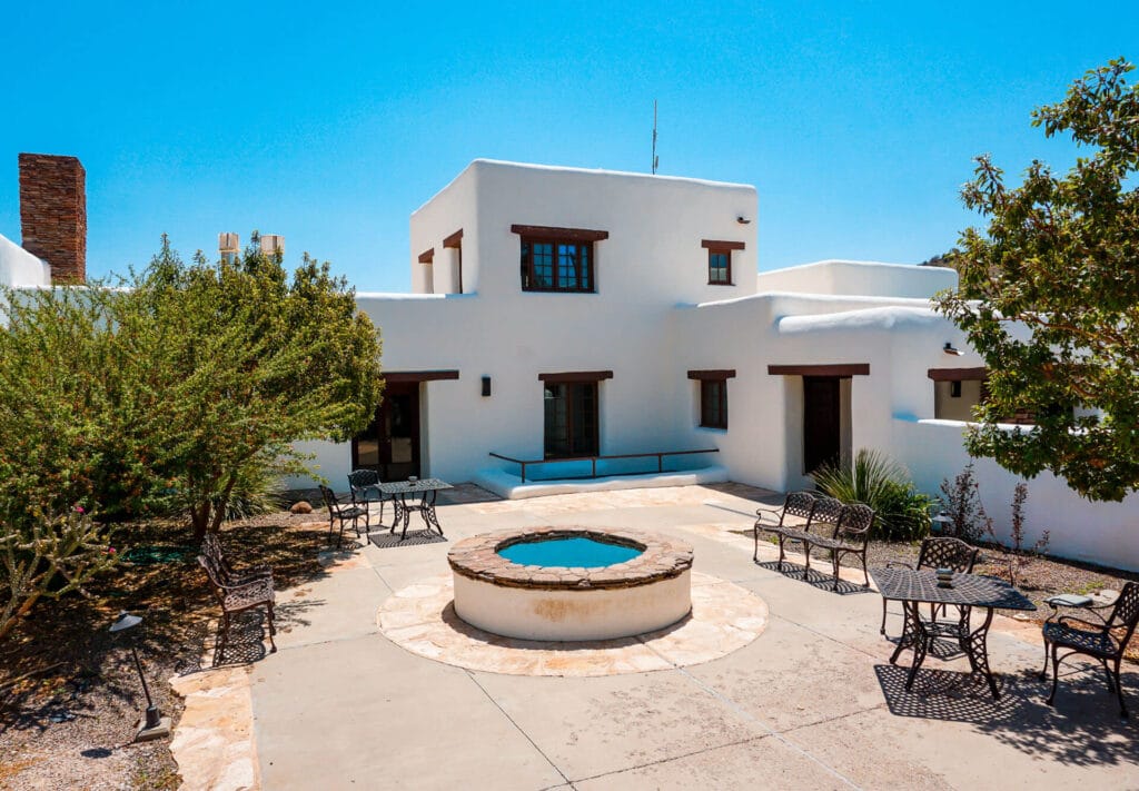 The Indian Lodge - a white adobe hotel at Davis Mountains State Park - visiting here is one of the best things to do in Fort Davis. 