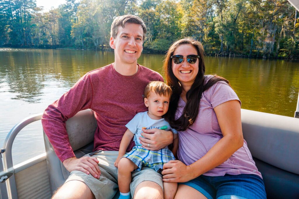 A family enjoying a boat tour with Captain Ron - a boat tour is one of the best things to do at Caddo Lake.