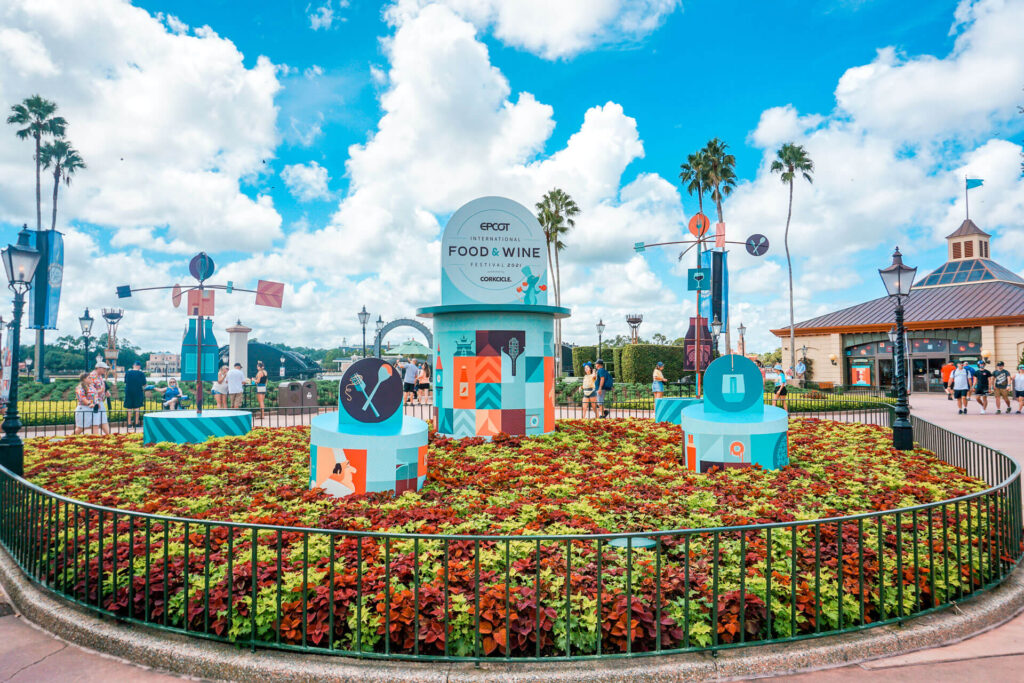 A flower garden featuring Epcot's Food and Wine Festival. 