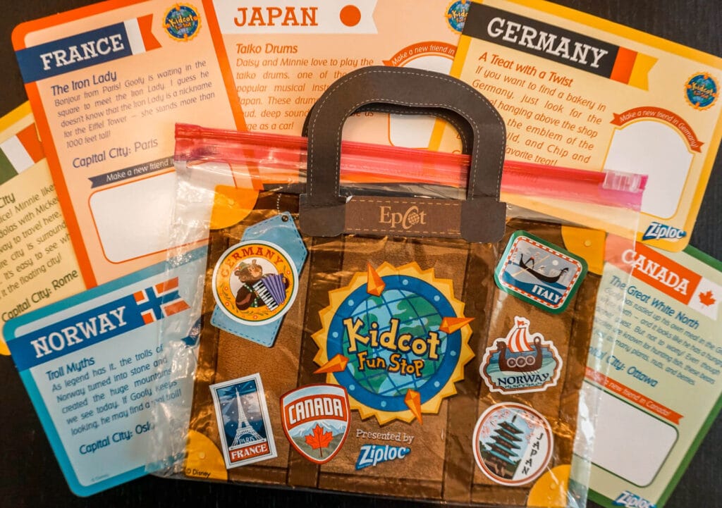 A Kidcot Fun Stop Ziploc suitcase bad with stickers and activity cards in the background.