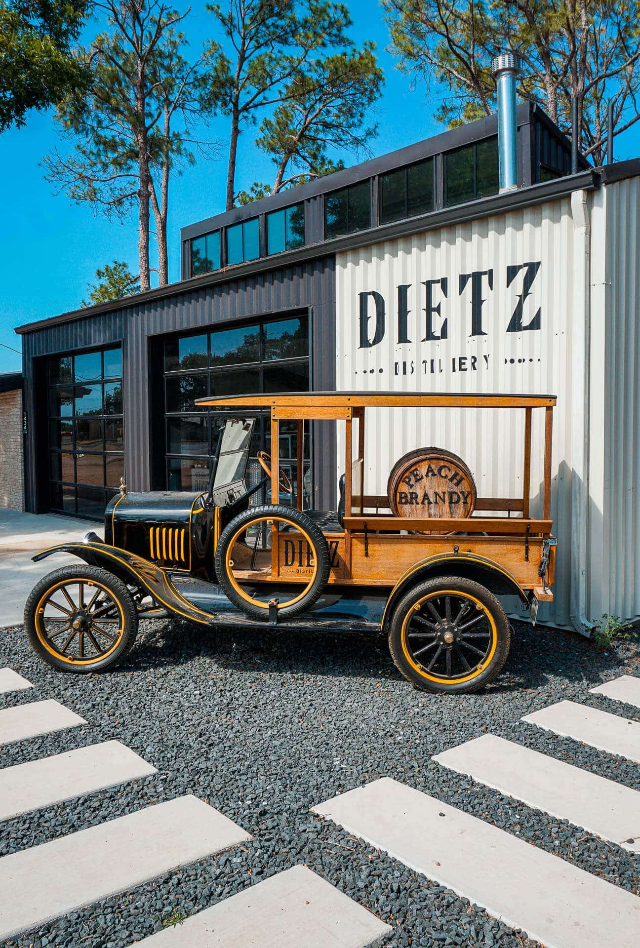 A vintage vehicle in front of Dietz Distillery in Fredericksburg, Texas