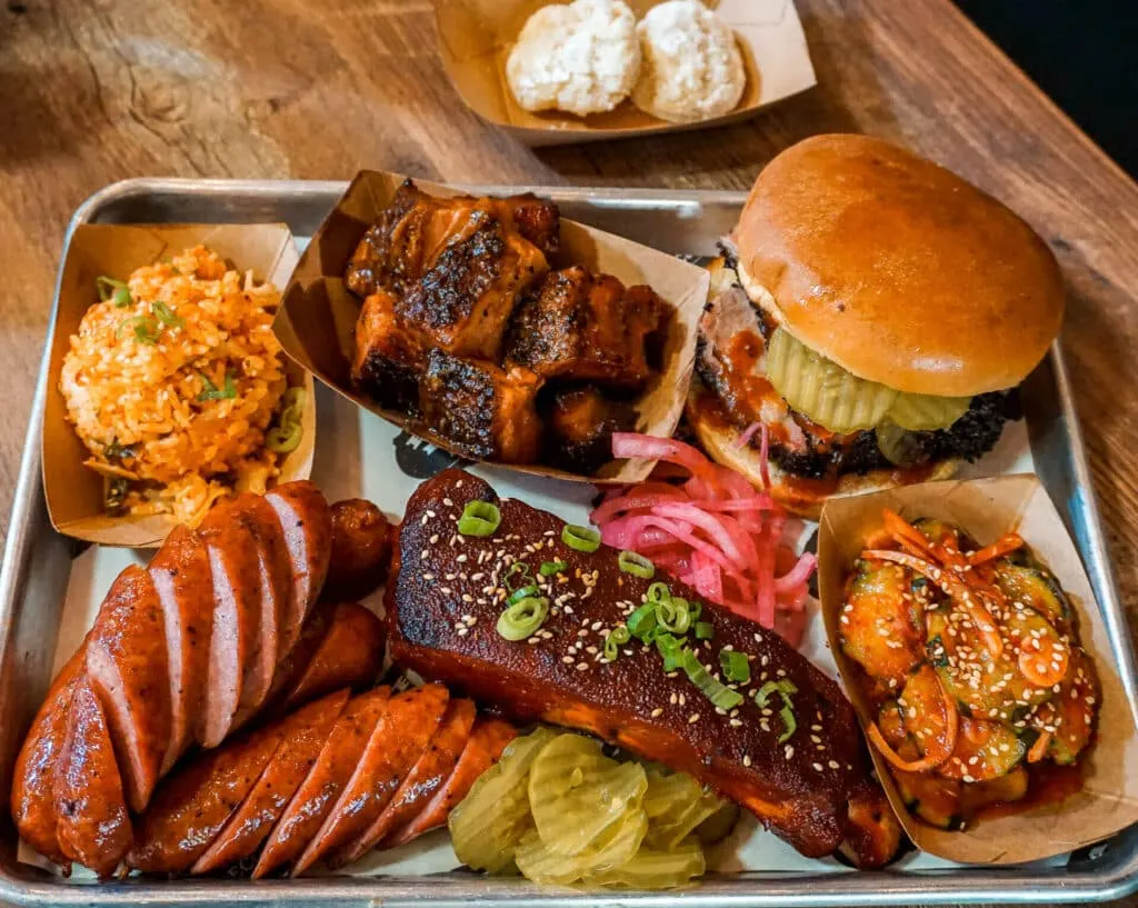 A plate full of South Texas-style BBQ with Korean side dishes from Eaker BBQ.