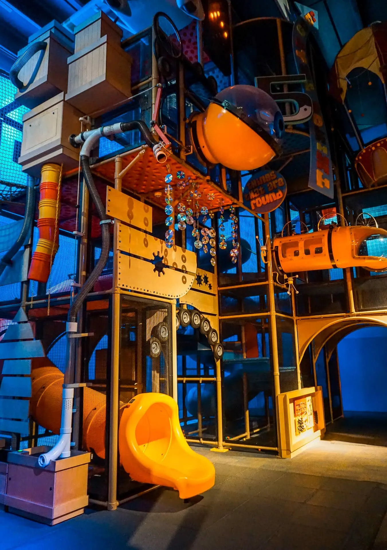 A whimsical orange and blue playground at Curio City.