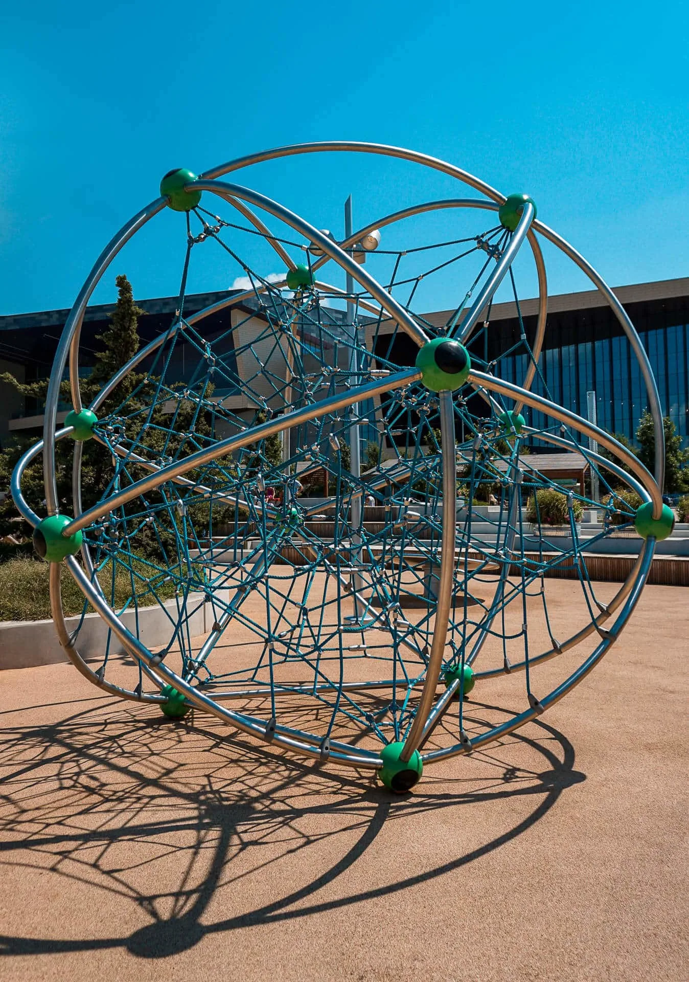 A geometrical climbing sphere at Scissortail Park.
