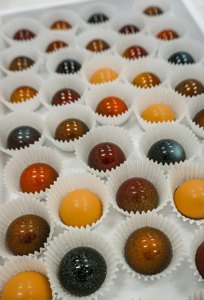 A tray of colorful chocolate bonbons from Hill Country Chocolate