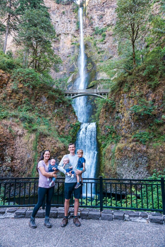 A family of five in front of the iconic Multnomah Falls - one of the best waterfalls in Columbia River Gorge. 