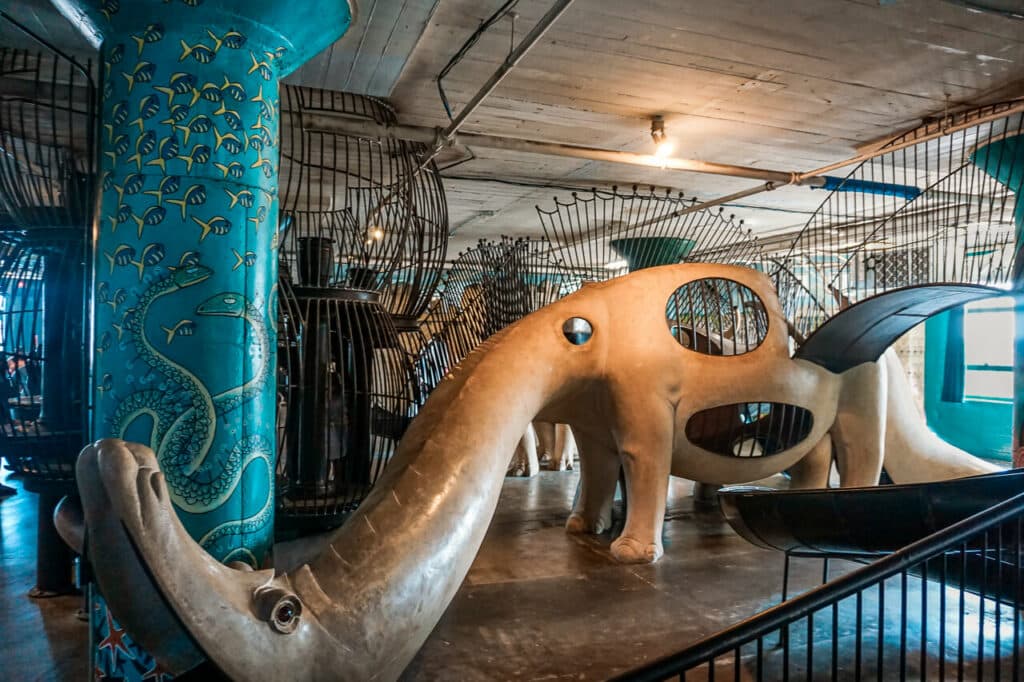 An industrial elephant slide and play structure at Toddler Town in the City Museum - one of the best things to do in St. Louis with toddlers.