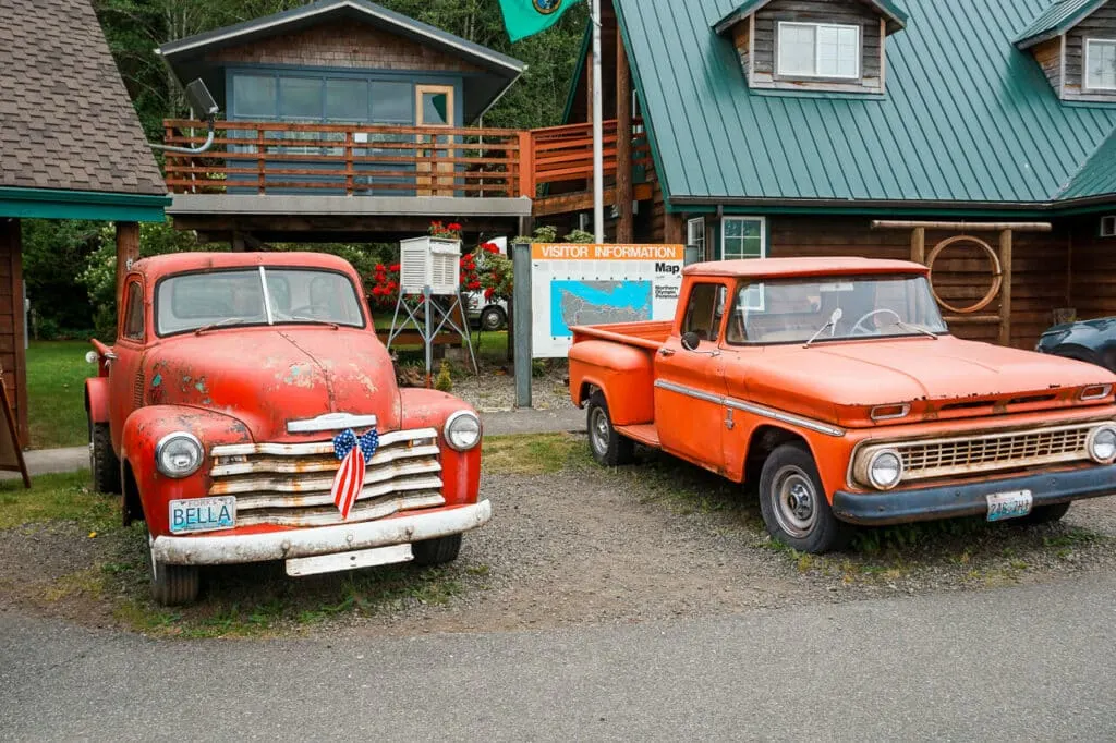Two red trucks from the Twilight Saga books and movies located in Forks.