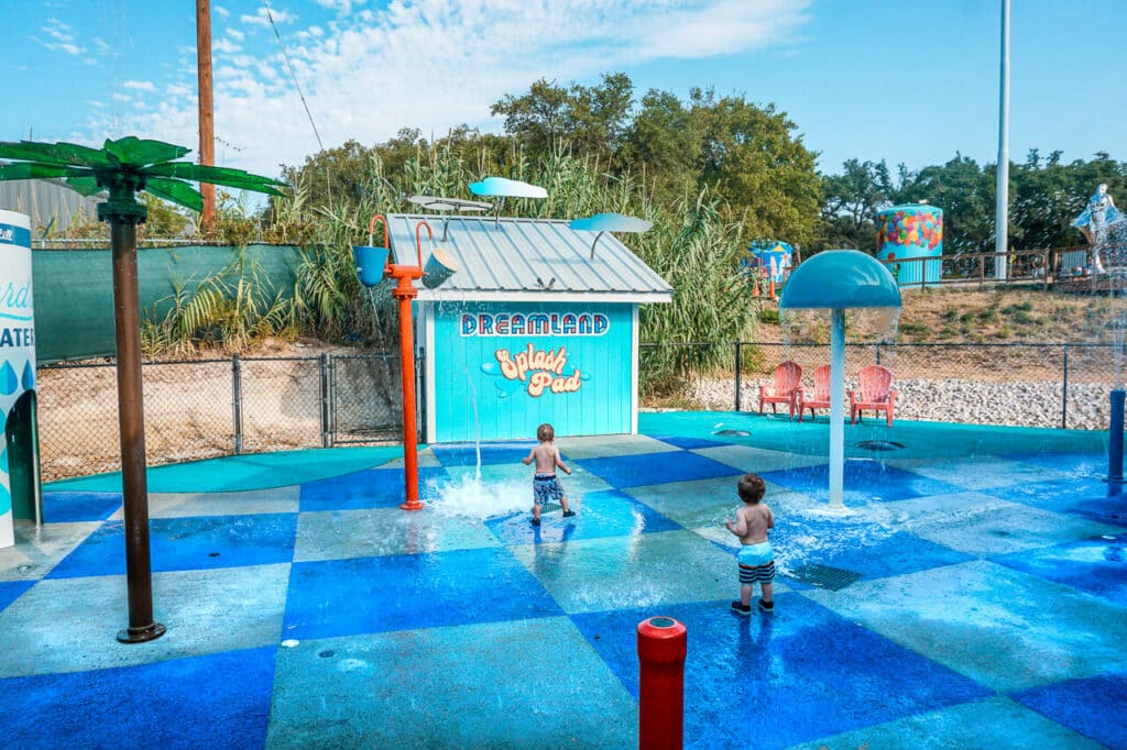 Boys playing in a splashed at Dreamland in Dripping Springs. 