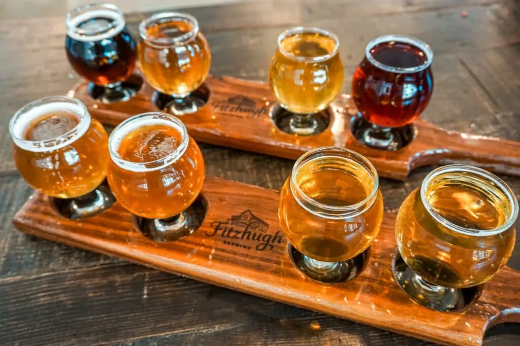 Two beer flights on wooden boards from Fitzhugh Brewery. 