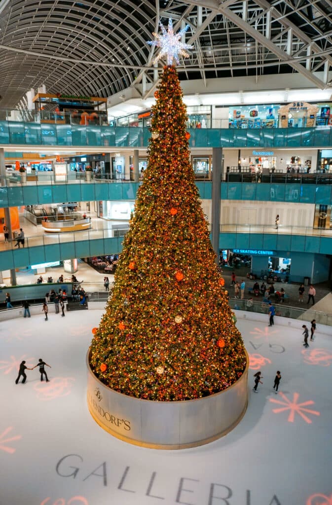 The tallest indoor Christmas tree, decorated in red ornaments, located at the Galleria Mall in Dallas.