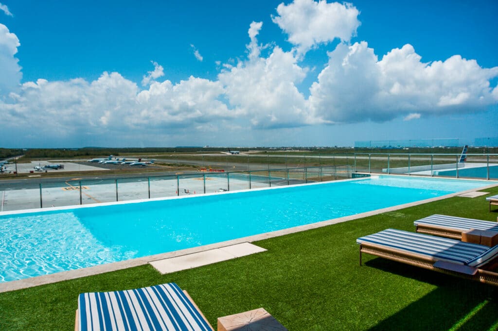 A long pool overlooking the runway at Punta Cana International Airport.