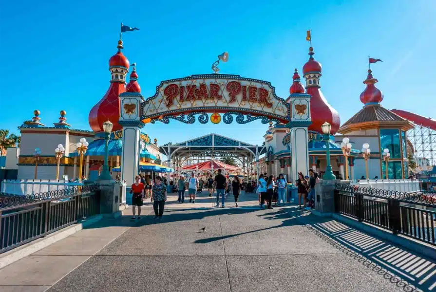People walking on Pixar Pier at Disney California Adventure Park.