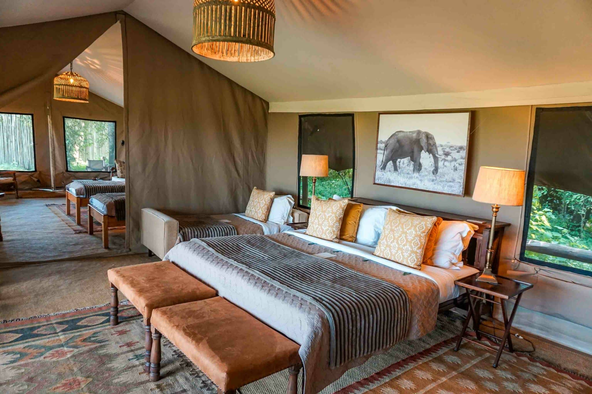 A family suite tent with king size bed, single bed and a second room with two more beds at Elewana Elephant Pepper Camp.